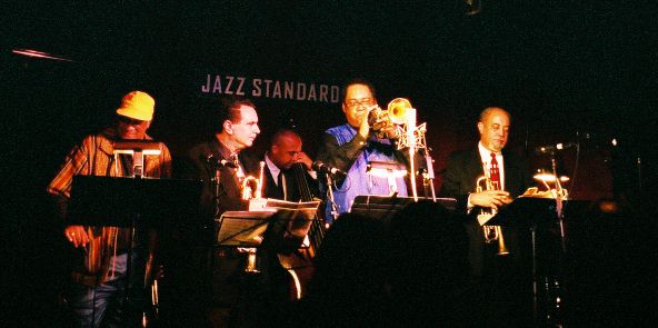 [From left to right: Cecil Bridgewater, Claudio Roditi, Faddis, and Jimmy Owens.  Bassist Peter Washington is seen in background.]