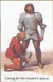 Squire dresses knight in armor