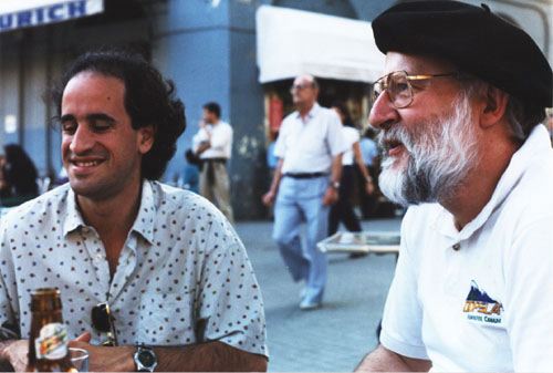 Picture of Jimenez-Peris and Bergin in street corner cafe.